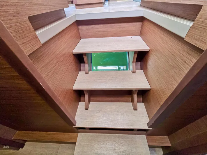Le Tigre Yacht Photos Pics Wooden interior stairs on a 2019 Lagoon 42 catamaran.