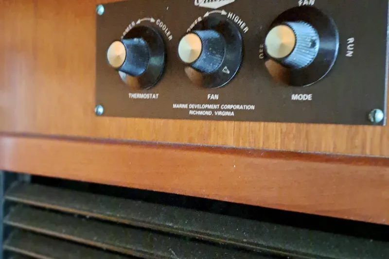 Jen & Tonic Yacht Photos Pics 1986 Post Sportfisher thermostat and fan control panel in wooden interior.