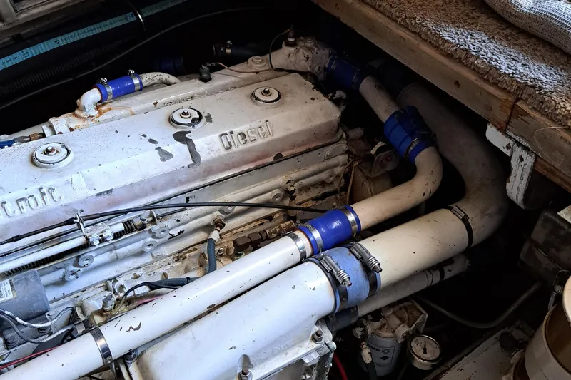 Jen & Tonic Yacht Photos Pics 1986 Post Sportfisher engine compartment with diesel engine and white piping.