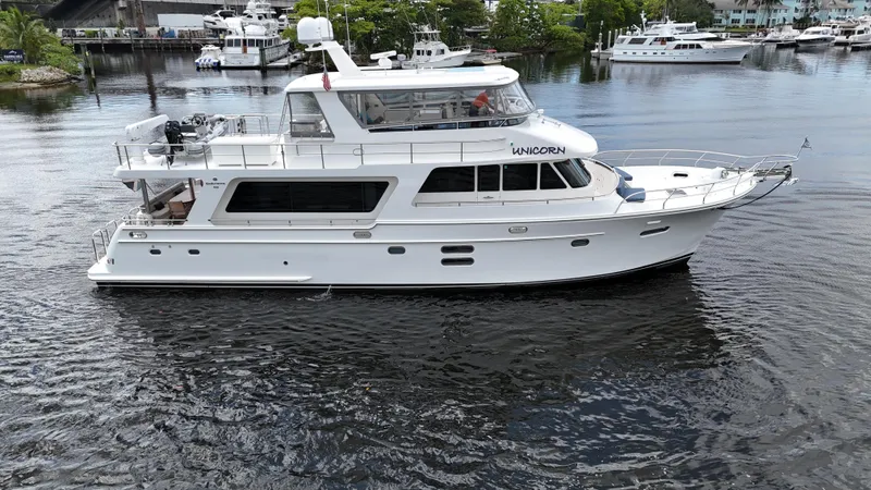 Unicorn Yacht Photos Pics 2020 Hampton 658l Endurance yacht on calm water, surrounded by other boats.
