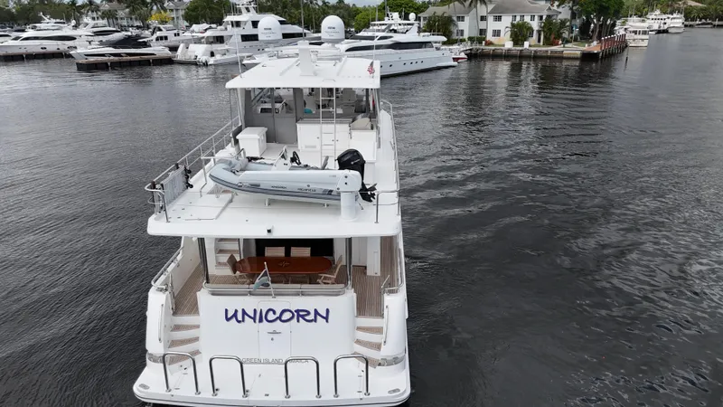 Unicorn Yacht Photos Pics Aerial view of 2020 Hampton 658l Endurance yacht named "Unicorn" docked in a marina.