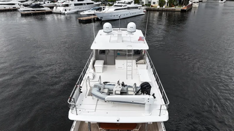 Unicorn Yacht Photos Pics 2020 Hampton 658l Endurance yacht docked at marina, aerial view.