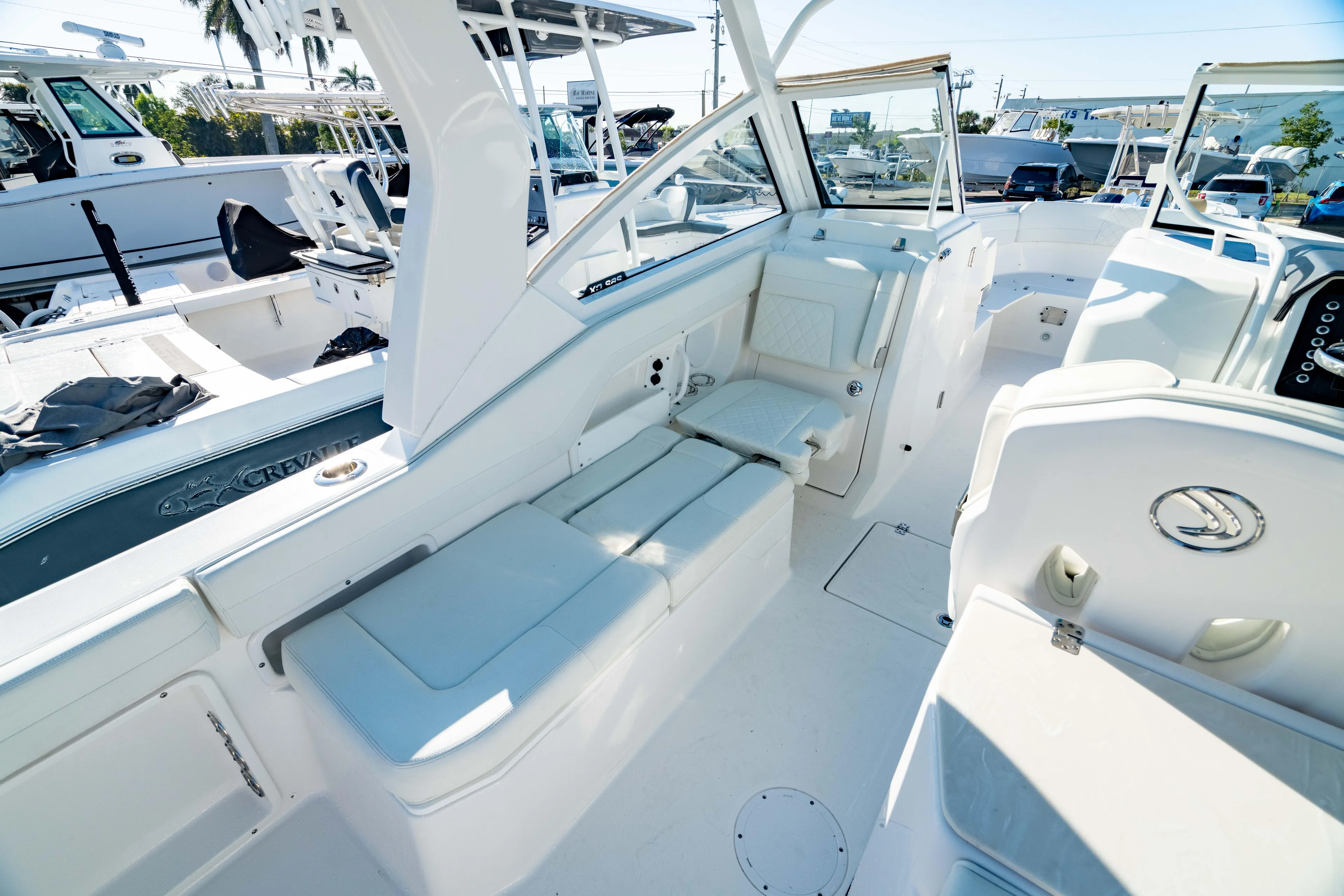  Yacht Photos Pics 2022 Edgewater 262 CX boat interior with white seating and modern design.