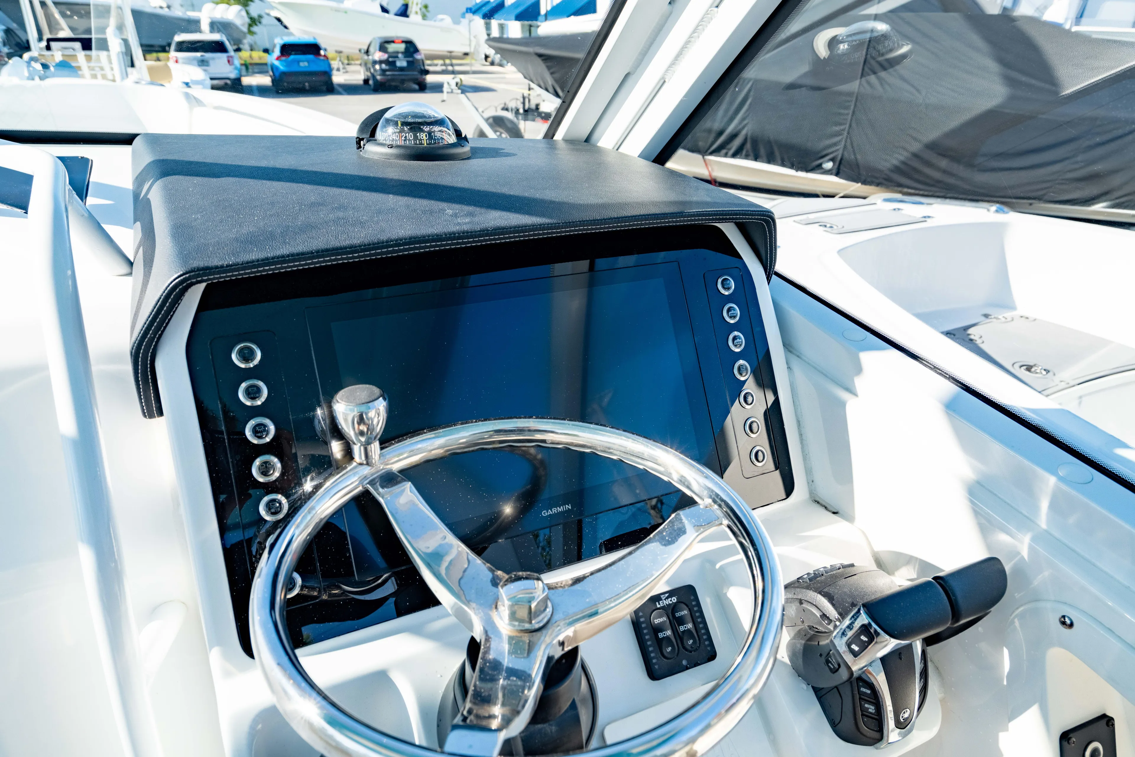  Yacht Photos Pics Edgewater 262 CX 2022 boat dashboard with steering wheel and controls.