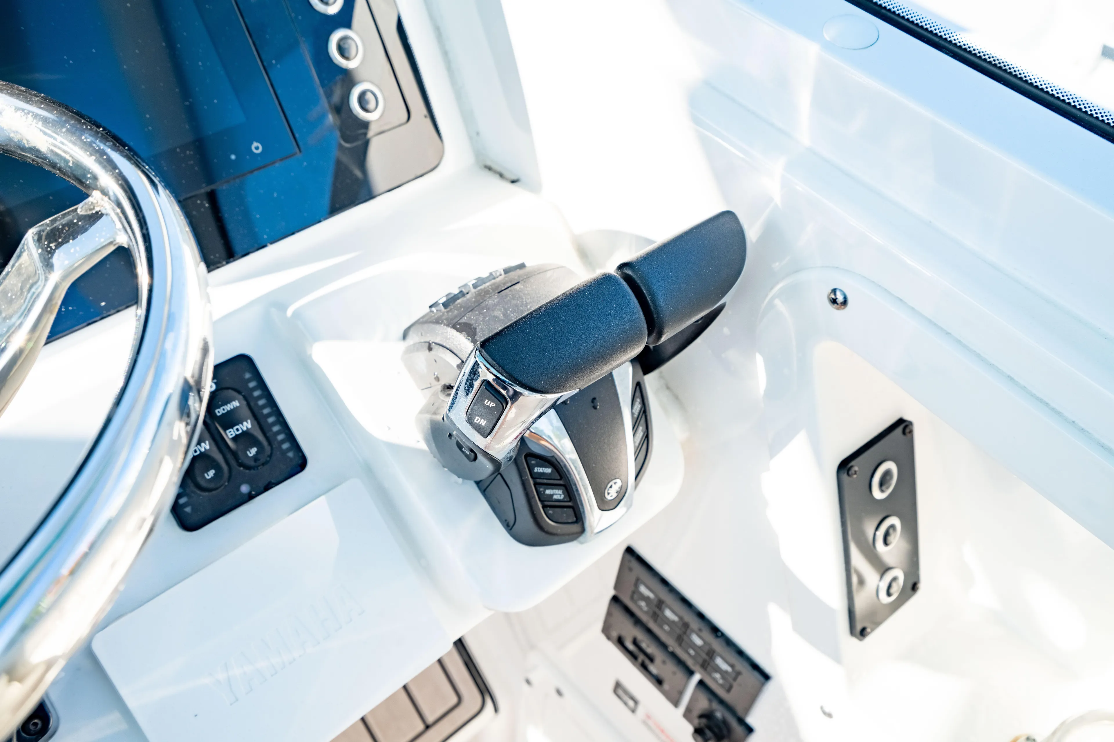  Yacht Photos Pics 2022 Edgewater 262 CX boat controls and steering wheel in cockpit.