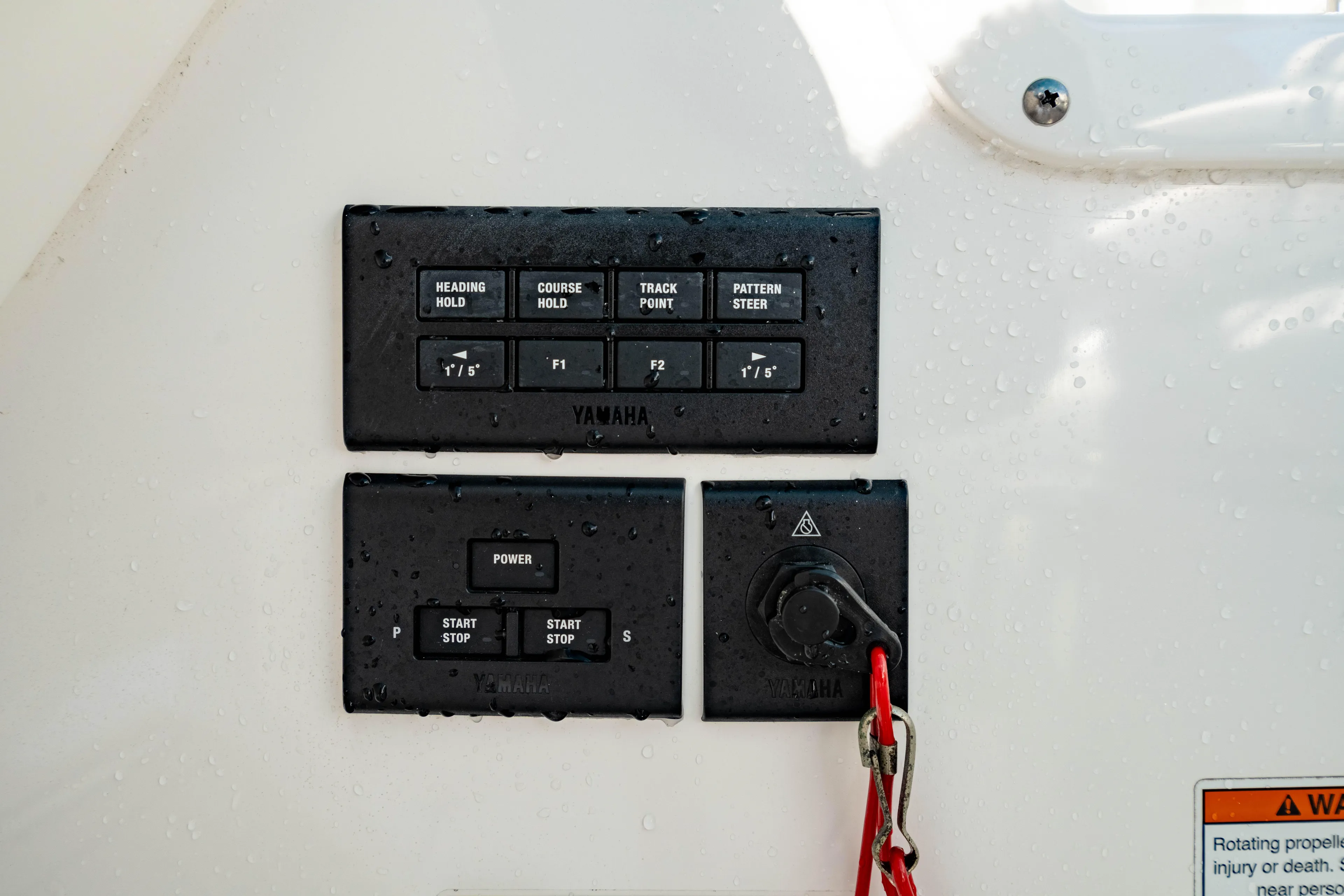  Yacht Photos Pics Control panel of 2022 Edgewater 262 CX boat with Yamaha buttons and safety key.