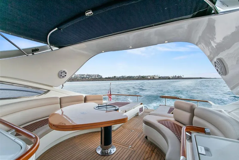 Rhapsody Yacht Photos Pics Luxurious 2004 Riva 59 Mercurius yacht interior with elegant seating and ocean view.