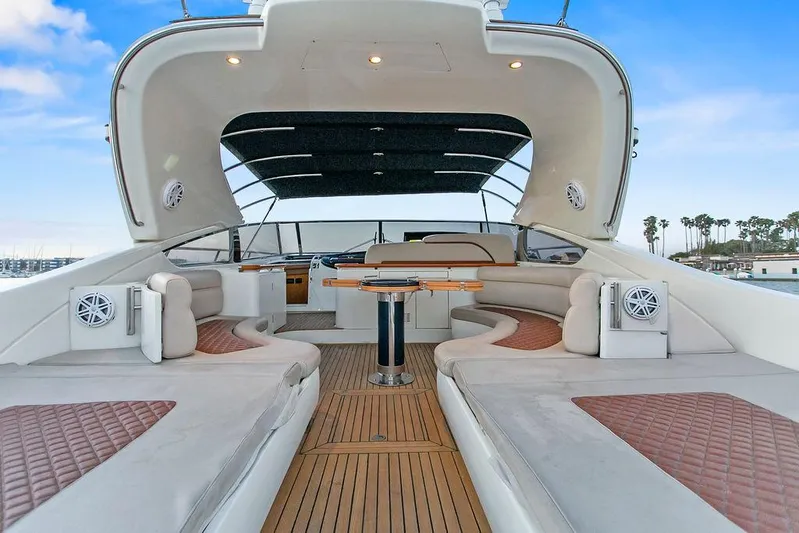 Rhapsody Yacht Photos Pics Luxurious 2004 Riva 59 Mercurius yacht interior with elegant seating and wooden flooring.