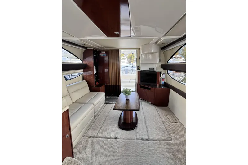 Tangerine Yacht Photos Pics Luxurious interior of a 2009 Meridian 341 Sedan yacht with elegant furnishings.