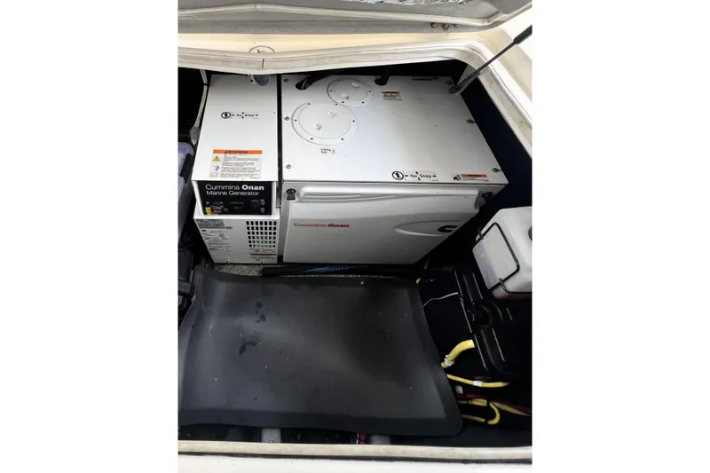 Tangerine Yacht Photos Pics Cummins Onan marine generator in 2009 Meridian 341 Sedan engine compartment.