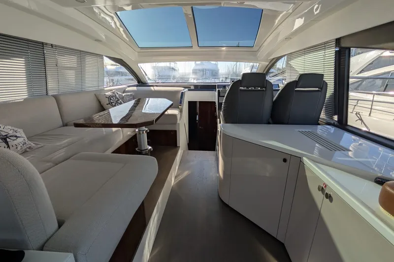 Seakeeper Gyro Yacht Photos Pics Luxurious interior of 2022 Fairline Targa 45 GT yacht with modern seating and panoramic windows.