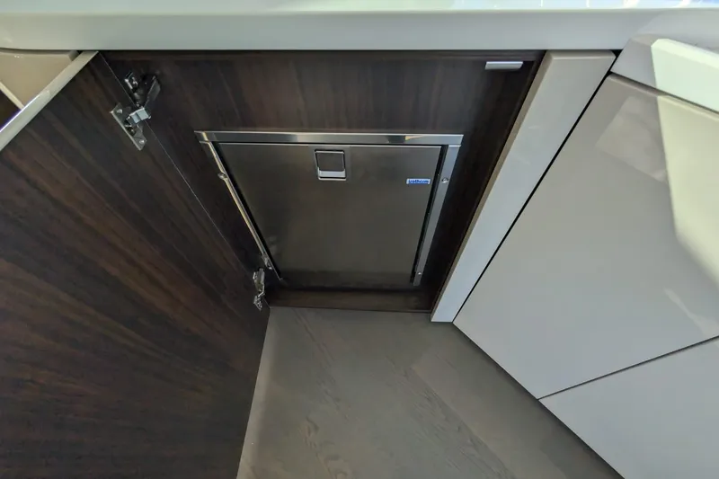 Seakeeper Gyro Yacht Photos Pics 2022 Fairline Targa 45 GT yacht interior with sleek cabinetry and integrated appliances.