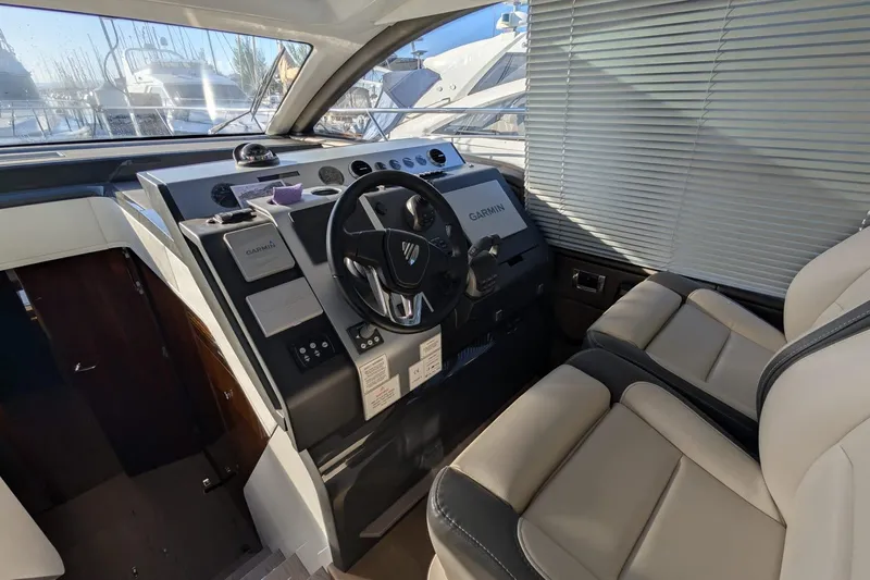 Seakeeper Gyro Yacht Photos Pics Interior cockpit of 2022 Fairline Targa 45 GT yacht with modern controls and seating.