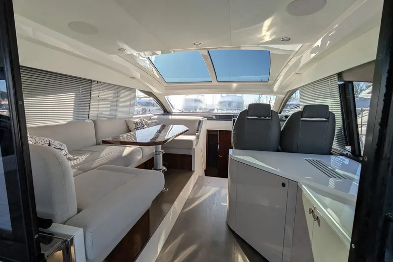 Seakeeper Gyro Yacht Photos Pics Luxurious interior of 2022 Fairline Targa 45 GT yacht with modern seating and skylight.