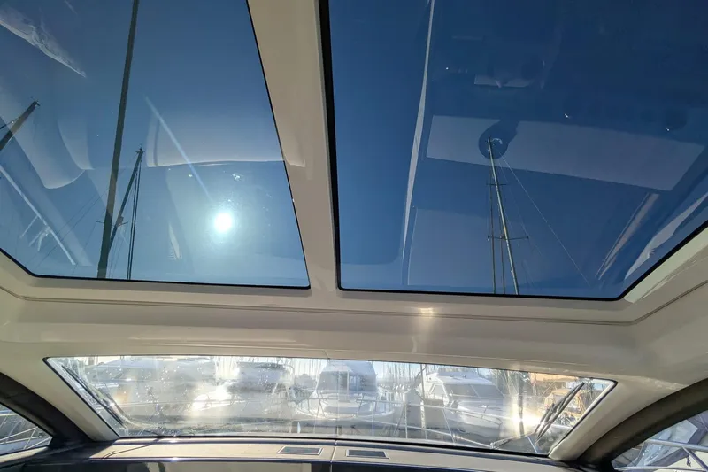 Seakeeper Gyro Yacht Photos Pics Sunroof view from 2022 Fairline Targa 45 GT yacht, showcasing clear blue sky.