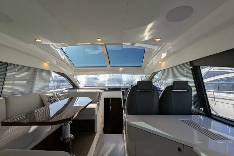 Seakeeper Gyro Yacht Photos Pics Luxurious interior of 2022 Fairline Targa 45 GT yacht with skylight and modern seating.