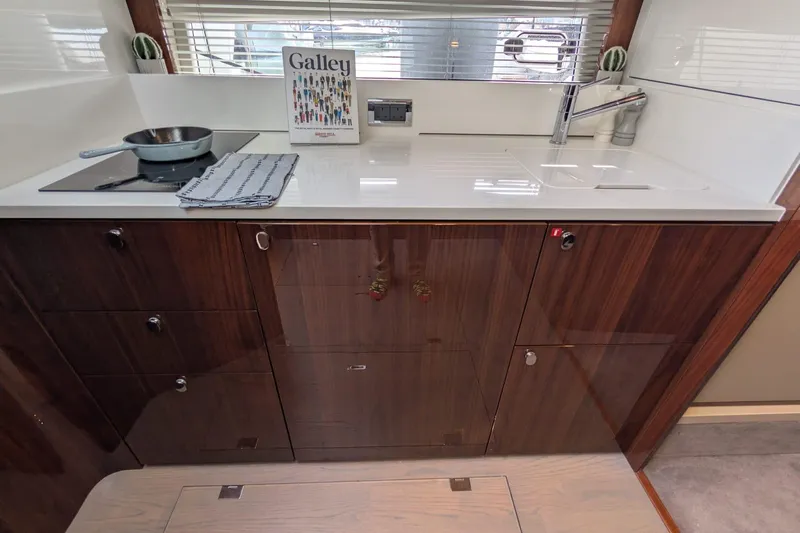 Seakeeper Gyro Yacht Photos Pics Modern galley kitchen in 2022 Fairline Targa 45 GT yacht with sleek cabinetry.