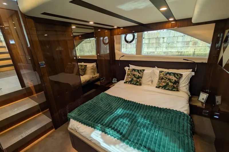 Seakeeper Gyro Yacht Photos Pics Luxurious 2022 Fairline Targa 45 GT yacht bedroom with elegant decor and modern design.