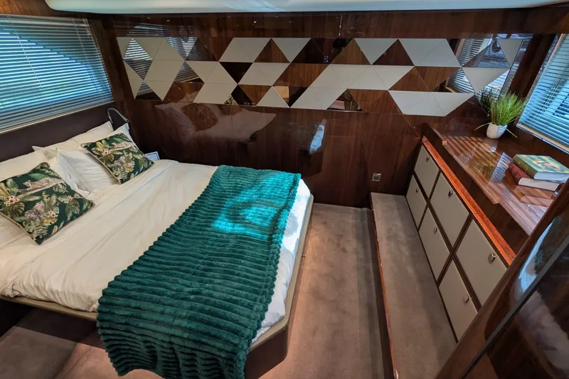 Seakeeper Gyro Yacht Photos Pics Luxurious bedroom interior of 2022 Fairline Targa 45 GT yacht with modern decor.