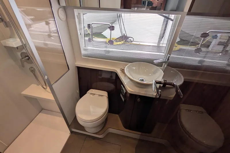 Seakeeper Gyro Yacht Photos Pics Luxurious bathroom in 2022 Fairline Targa 45 GT yacht, featuring modern fixtures and elegant design.