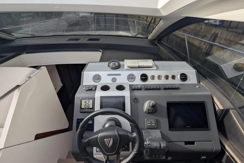 Seakeeper Gyro Yacht Photos Pics 2022 Fairline Targa 45 GT helm with modern navigation controls and sleek design.