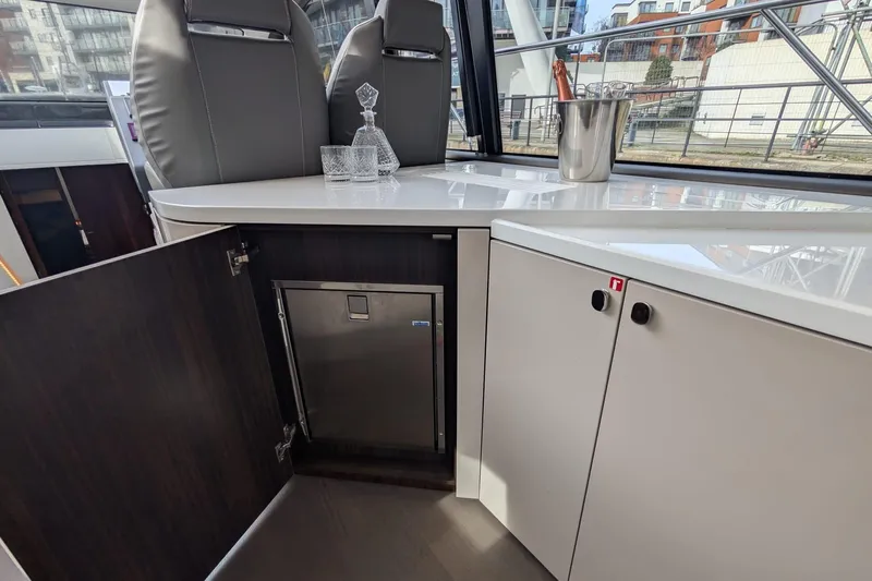 Seakeeper Gyro Yacht Photos Pics Interior of 2022 Fairline Targa 45 GT yacht with modern cabinetry and bar setup.