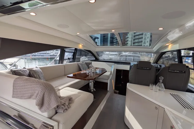 Seakeeper Gyro Yacht Photos Pics Luxurious interior of 2022 Fairline Targa 45 GT yacht with elegant seating and dining area.