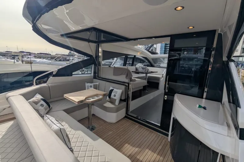 Seakeeper Gyro Yacht Photos Pics Luxurious 2022 Fairline Targa 45 GT yacht interior with elegant seating and modern design.