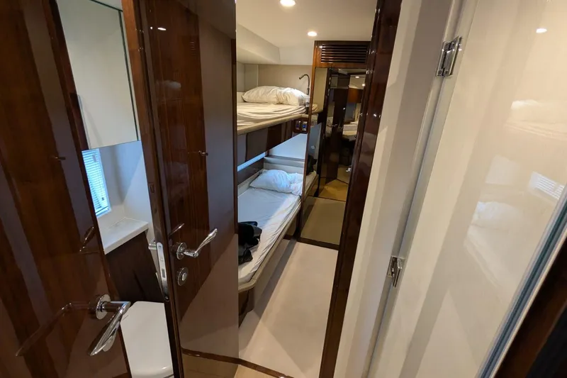Seakeeper Gyro Yacht Photos Pics Interior of 2022 Fairline Targa 45 GT yacht with bunk beds and wooden finishes.