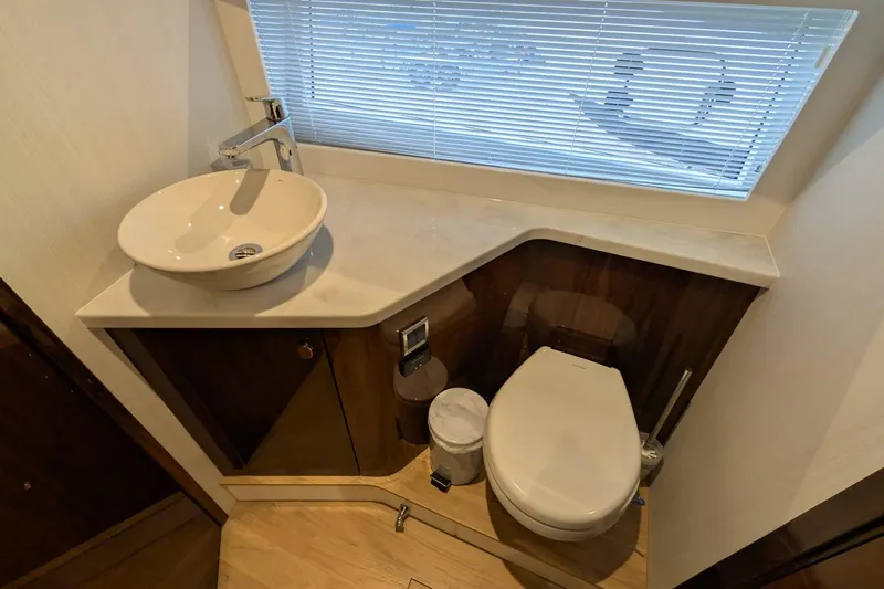 Seakeeper Gyro Yacht Photos Pics Luxury bathroom in 2022 Fairline Targa 45 GT yacht with modern sink and toilet.