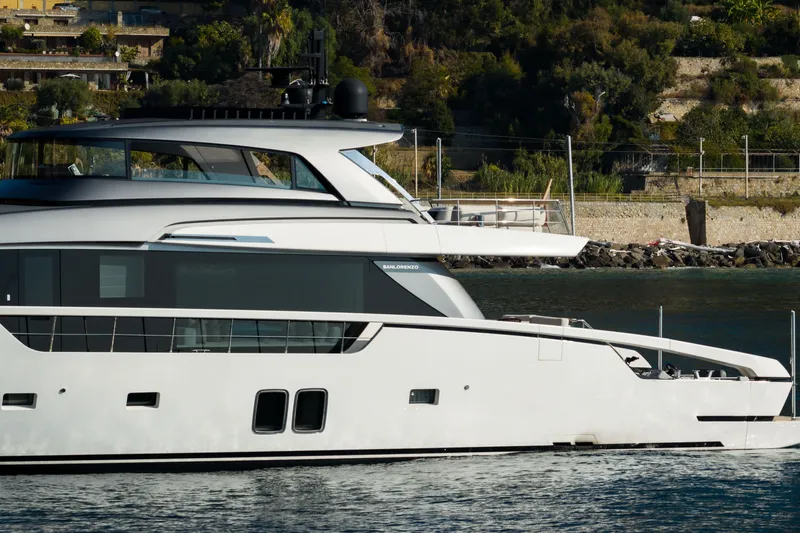 La Yacht Photos Pics Sanlorenzo SX88 2022 yacht cruising near a scenic coastline.