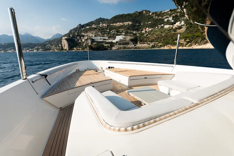 La Yacht Photos Pics Luxurious 2022 Sanlorenzo SX88 yacht deck with scenic coastal view.
