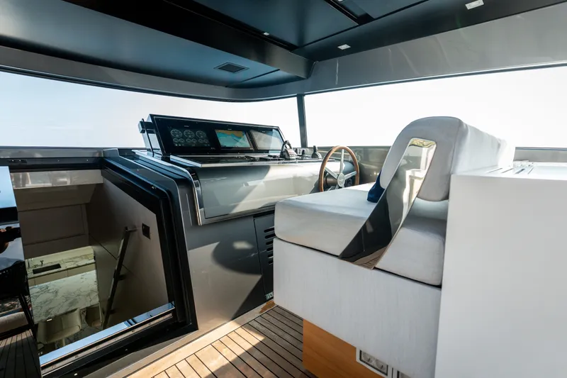 La Yacht Photos Pics 2022 Sanlorenzo SX88 yacht helm with modern controls and luxurious seating.