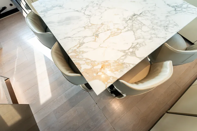 La Yacht Photos Pics Luxurious marble table and chairs on Sanlorenzo SX88 yacht, 2022 model.