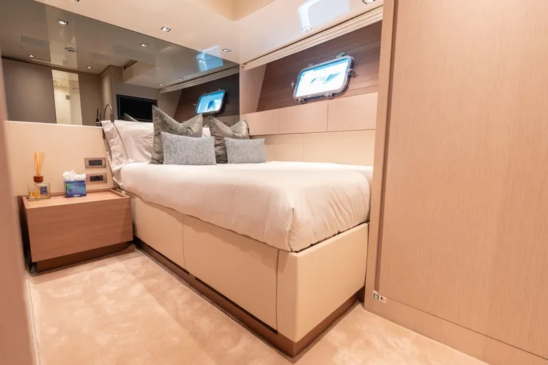 La Yacht Photos Pics Luxurious bedroom interior of 2022 Sanlorenzo SX88 yacht with modern design and cozy ambiance.