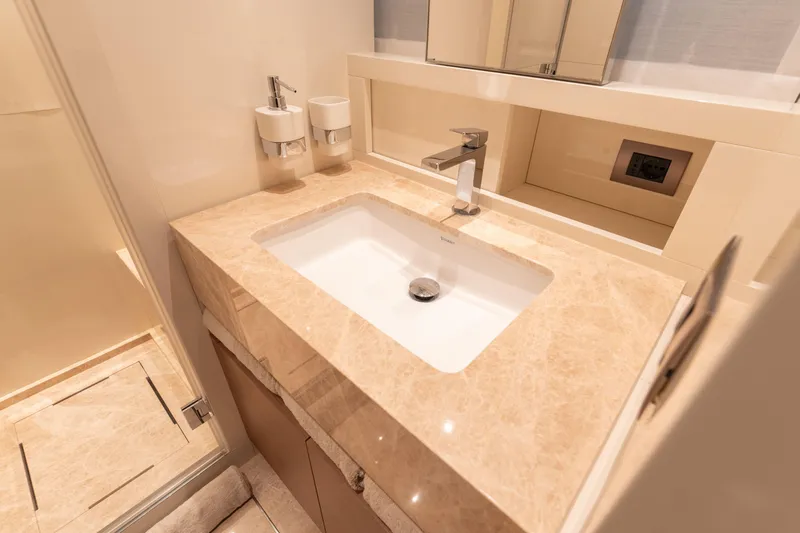 La Yacht Photos Pics Luxurious bathroom sink in 2022 Sanlorenzo SX88 yacht, featuring elegant marble countertop.
