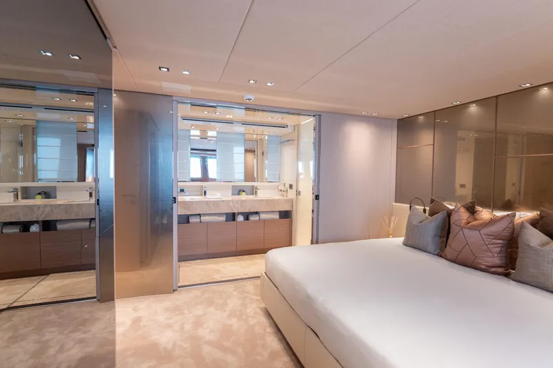 La Yacht Photos Pics Luxurious bedroom and bathroom interior of 2022 Sanlorenzo SX88 yacht.