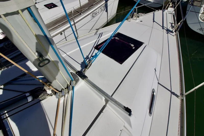  Yacht Photos Pics 2008 Hanse 370e sailboat deck with rigging and hatch, docked in marina.