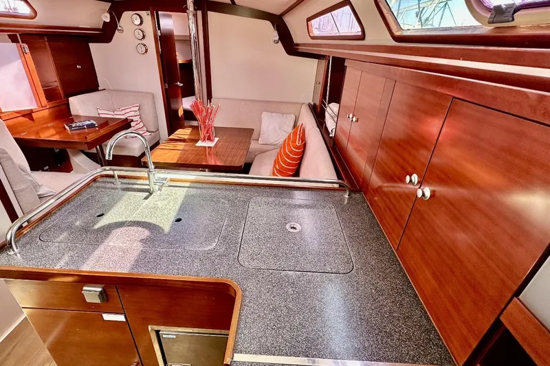  Yacht Photos Pics Luxurious interior of 2008 Hanse 370e yacht with modern kitchen and cozy seating area.