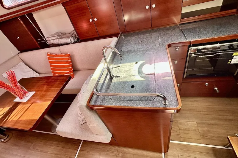  Yacht Photos Pics Interior of 2008 Hanse 370e yacht with modern kitchen and cozy seating area.