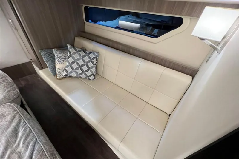  Yacht Photos Pics Luxurious interior of 2023 Regal 42 Fly yacht with elegant seating and decorative pillows.