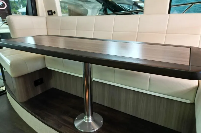  Yacht Photos Pics Luxurious interior seating and table on 2023 Regal 42 Fly yacht.