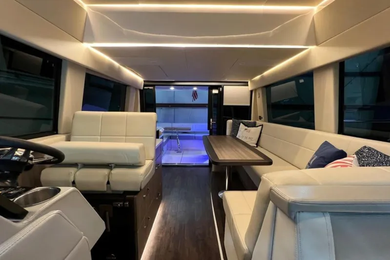  Yacht Photos Pics Luxurious interior of 2023 Regal 42 Fly yacht with elegant seating and ambient lighting.