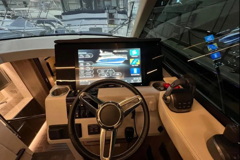  Yacht Photos Pics 2023 Regal 42 Fly yacht helm with advanced navigation display and controls.