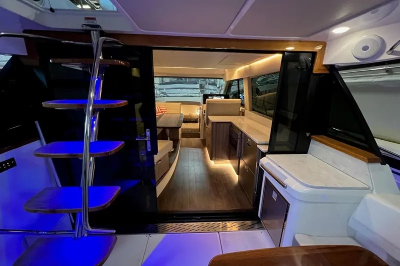  Yacht Photos Pics Interior of 2023 Regal 42 Fly yacht with modern kitchen and seating area.