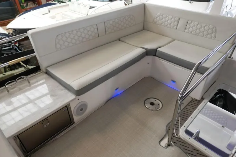  Yacht Photos Pics Luxurious seating area on 2023 Regal 42 Fly yacht with modern design and ambient lighting.
