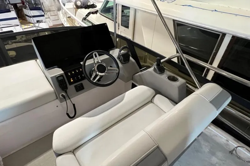  Yacht Photos Pics 2023 Regal 42 Fly yacht helm with modern steering and controls.