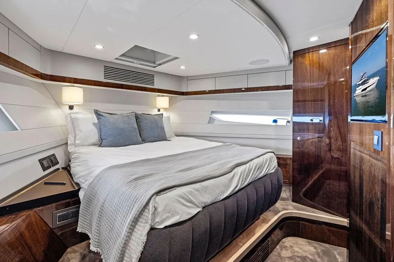  Yacht Photos Pics Luxurious bedroom interior of 2024 Fairline Squadron 68 yacht with elegant design.