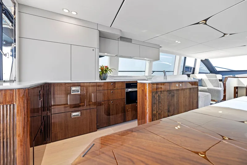  Yacht Photos Pics Luxurious interior of 2024 Fairline Squadron 68 yacht with modern kitchen design.