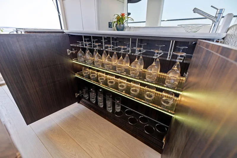  Yacht Photos Pics Luxury yacht bar cabinet with glassware, Fairline 2024 Squadron 68.